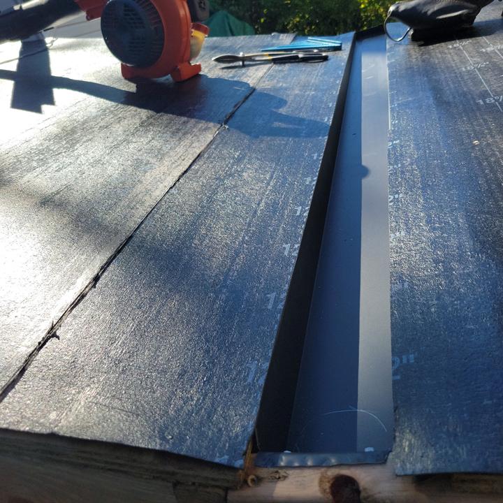 New metal valley flashing and underlayment where two roof planes meet